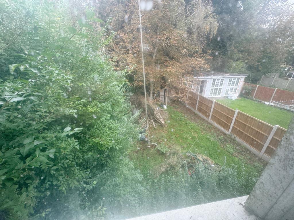 Lot: 95 - THREE-BEDROOM SEMI-DETACHED HOUSE FOR IMPROVEMENT - View of rear garden from first floor
